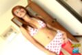 Long hair falling over her shoulders skirt raised stocking tops exposed